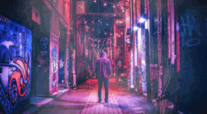 Hooded Man standing with his back to us in a graffitied and neon lit alley way