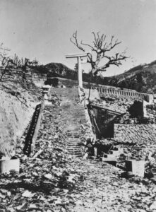 The one-legged torii gate to the Shinto shrine at Sanno, Nagasaki. The gate was 800 metres from the epicentre and the blast destroyed one of the legs, leaving the rest of the gate standing. The photographer, then TX3350 Private Allan Clifford Chick, 2/40 Infantry Battalion, was in prisoner of war (POW) Camp 14 Nagasaki at the time of the blast.